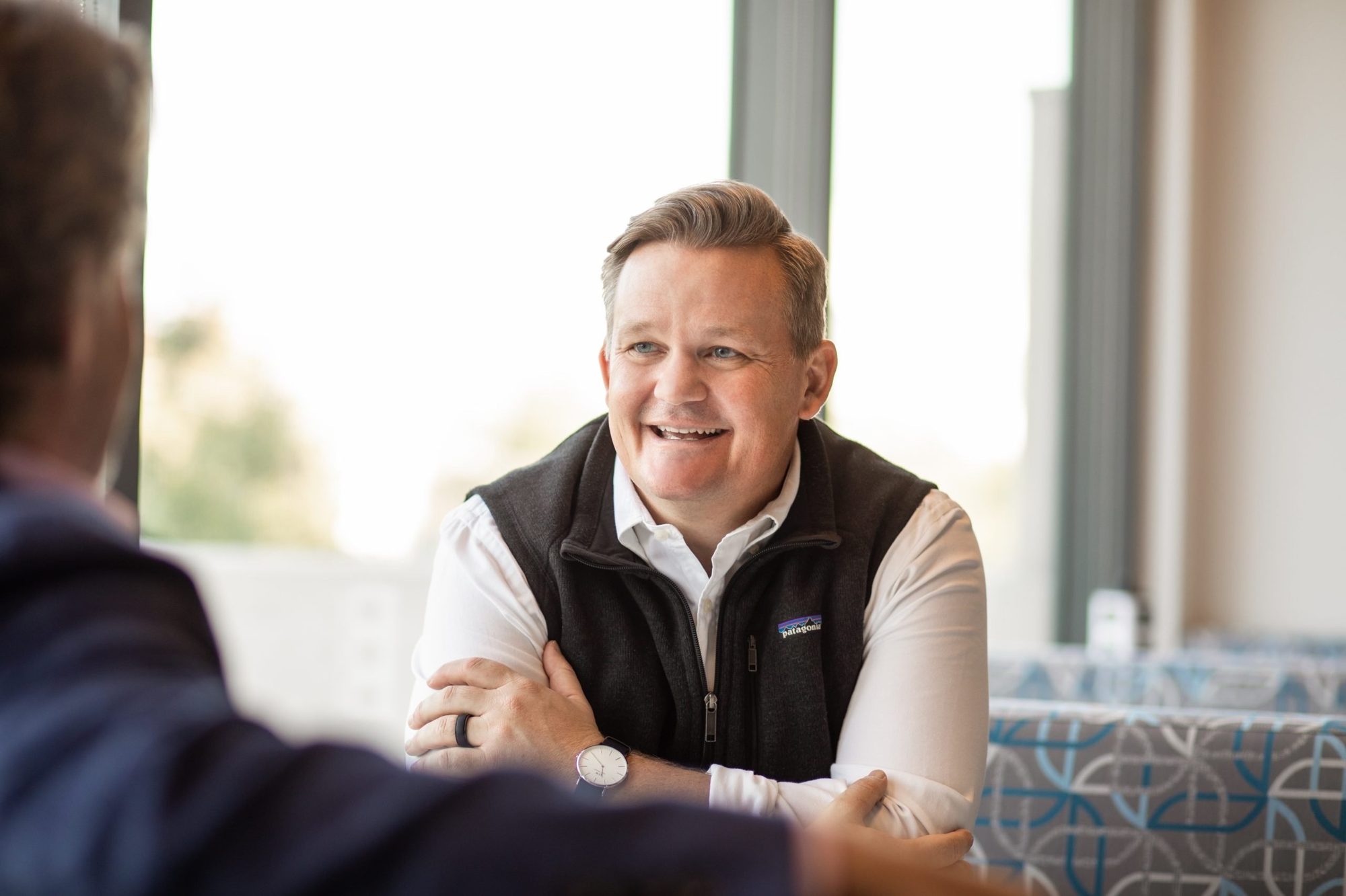 Nick Kennedy talking with a client across the table
